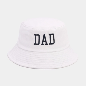 Detailed view of black DAD embroidery on a white cotton sun protection bucket hat