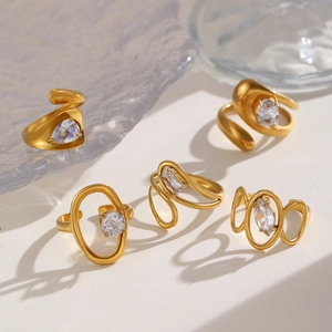 Close-up of assorted 18K gold plated stainless steel rings with zircon stones