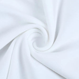 Close-up of white knitted fabric texture showing soft cotton blend and fine ribbed details