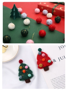 Close-up of wool felt Christmas ornaments including colorful balls and trees