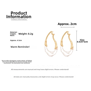 Detail showing irregular resin teardrop earrings with gold plating and ice crystal texture