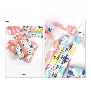 Detail of colorful cartoon birthday wrapping paper rolls with ribbons and gift boxes