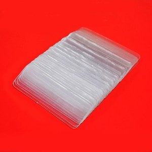 Transparent double-sided adhesive tabs for festive couplets on a vibrant red background