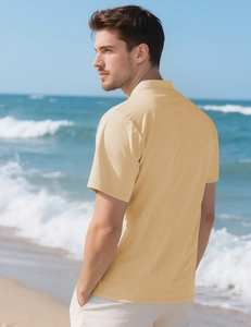 Close-up of men's polo shirt showing yellow piqué breathable mesh fabric texture