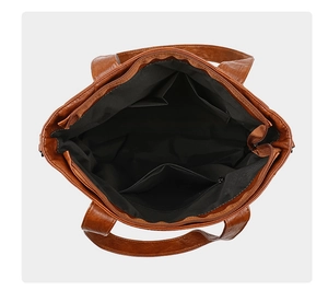 Internal view showing brown lychee texture leather tote with spacious zipper compartments