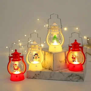 Miniature vintage Christmas LED lanterns with Santa and snowman figures on marble steps
