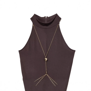 Dark brown halter top with gold chain body jewelry and Y-shaped tassel pendant