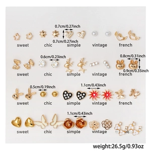 Detailed set of 20 pairs of mini gold-plated earrings with colorful enamel animal designs