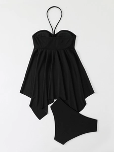 Flat lay of black ribbed two-piece halter swimsuit with peplum ruffle detail and high waist bottoms