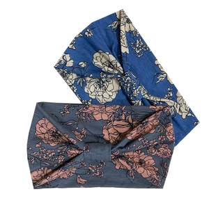 Detail view of two bohemian floral print yoga headbands in blue and greyish-blue tones
