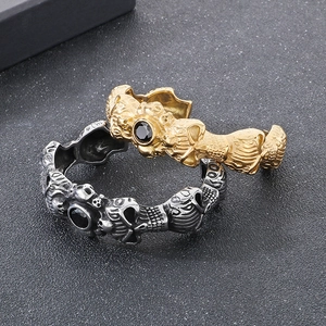 Gothic skull open bracelets in gold and silver finish with black faceted gemstones