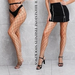 Close-up of black high-waisted fishnet stockings with sparkling silver rhinestone accents