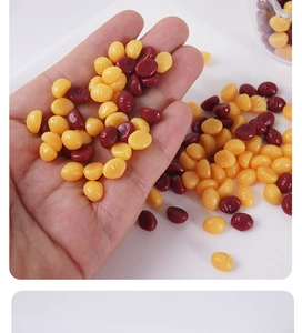Macro detail of yellow and burgundy sealing wax beads for DIY stamp and craft decoration