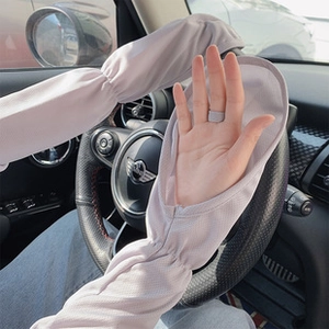 Close-up of light grey sun protection cooling sleeves for driving and outdoor sports