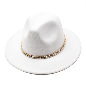 Detail of a white fedora hat featuring a gold Cuban link chain around the wide brim band