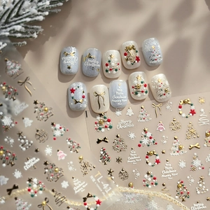 Luxury 5D embossed Christmas nail stickers with gold stars and reindeer on nails