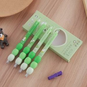 Set of 4 soft-grip retractable gel pens with quick-dry ink on a wooden desk surface