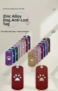 Detail of glitter zinc alloy rectangular dog tags featuring 3D embossed paw print designs