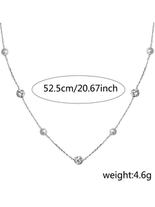 Detailed view of 52.5cm Y-shaped necklace with faux pearls and textured silver beads