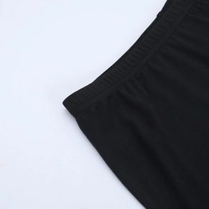 Detail view of the black elastic waistband on soft knit lace three-piece skirt set