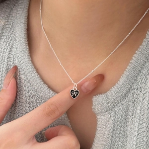 925 silver beaded chain necklace featuring a black enamel heart pendant with silver bow