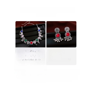 Detailed view of bohemian floral necklace set with colorful crystals and silver beads