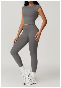 Detail of grey short sleeve crop top and high waist yoga leggings set in matte fabric
