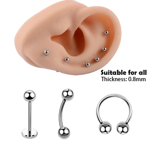 Stainless steel body piercing jewelry set with 0.8mm studs and horseshoe rings on ear