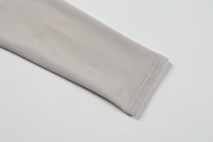 Detail of light grey knit fabric sleeve cuff with professional double needle stitching