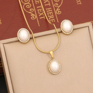 Elegant gold jewelry set with faux pearl heart necklace and matching round stud earrings