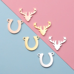 Polished mirror finish stainless steel antler and horseshoe charms in three metal colors