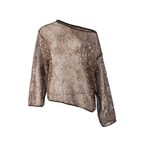 Close-up of brown sequined mesh top featuring long sleeves and sheer sequin texture