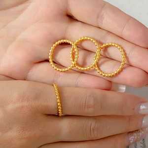 Elegant gold titanium steel ring with minimalist beaded texture design for women