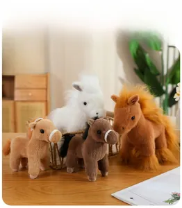 Detail of four colorful plush horse toys showing soft texture and reins on a wooden desk