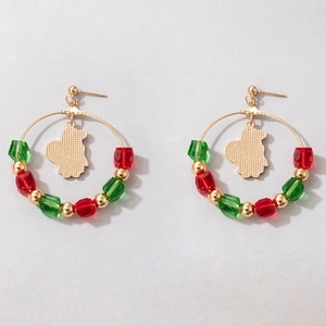 Detail of Christmas hoop earrings with red and green beads and a golden charm profile
