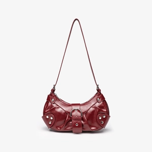 Detail shot of the wine red crocodile texture bag with buckle and silver metal rivets