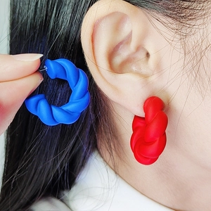 Matte acrylic twist hoop earrings in red and blue, minimalist exaggerated C-shape style