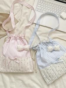 Sweet striped tote bag with bow detail and heart pattern in pink and blue versions