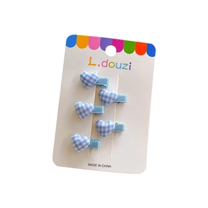 Set of 5 heart-shaped blue and white checkered hair clips for kids on display card