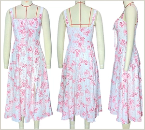 Front, back and side views of a French style floral strap dress on a mannequin
