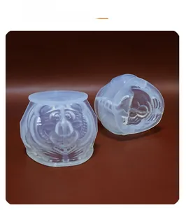 Detail view of two-piece food-grade silicone tiger molds with intricate facial textures