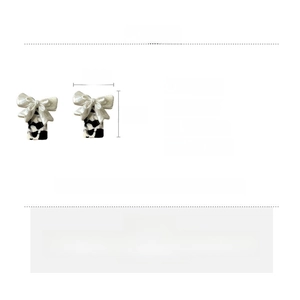 Detail specifications of black and white resin bow earrings with dimensions and weight