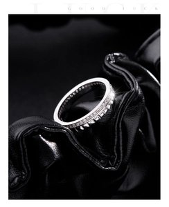Detail of silver S925 ring featuring sparkling pavé diamonds and geometric stud textures
