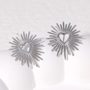 Silver heart starburst stud earrings in stainless steel with detailed cutout sunburst design