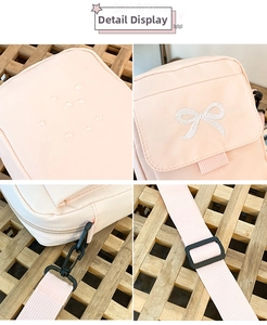 Detail of pink waterproof crossbody bag with white bow embroidery and nylon strap