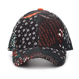 Ethnic style floral baseball cap with mixed patterns and orange button detail