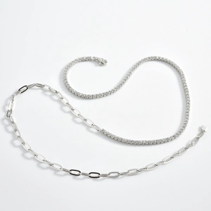 Detail of S925 silver necklace merging tennis chain with paperclip links and lobster clasp