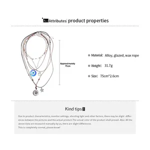 Detail view of 6-piece bohemian necklace set with evil eye, sun, and star charms