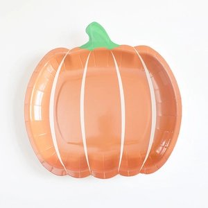 Close-up of orange pumpkin-shaped disposable paper plate for Thanksgiving parties