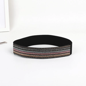 Detailed view of elastic belt featuring multicolored sparkling rainbow stripes on black